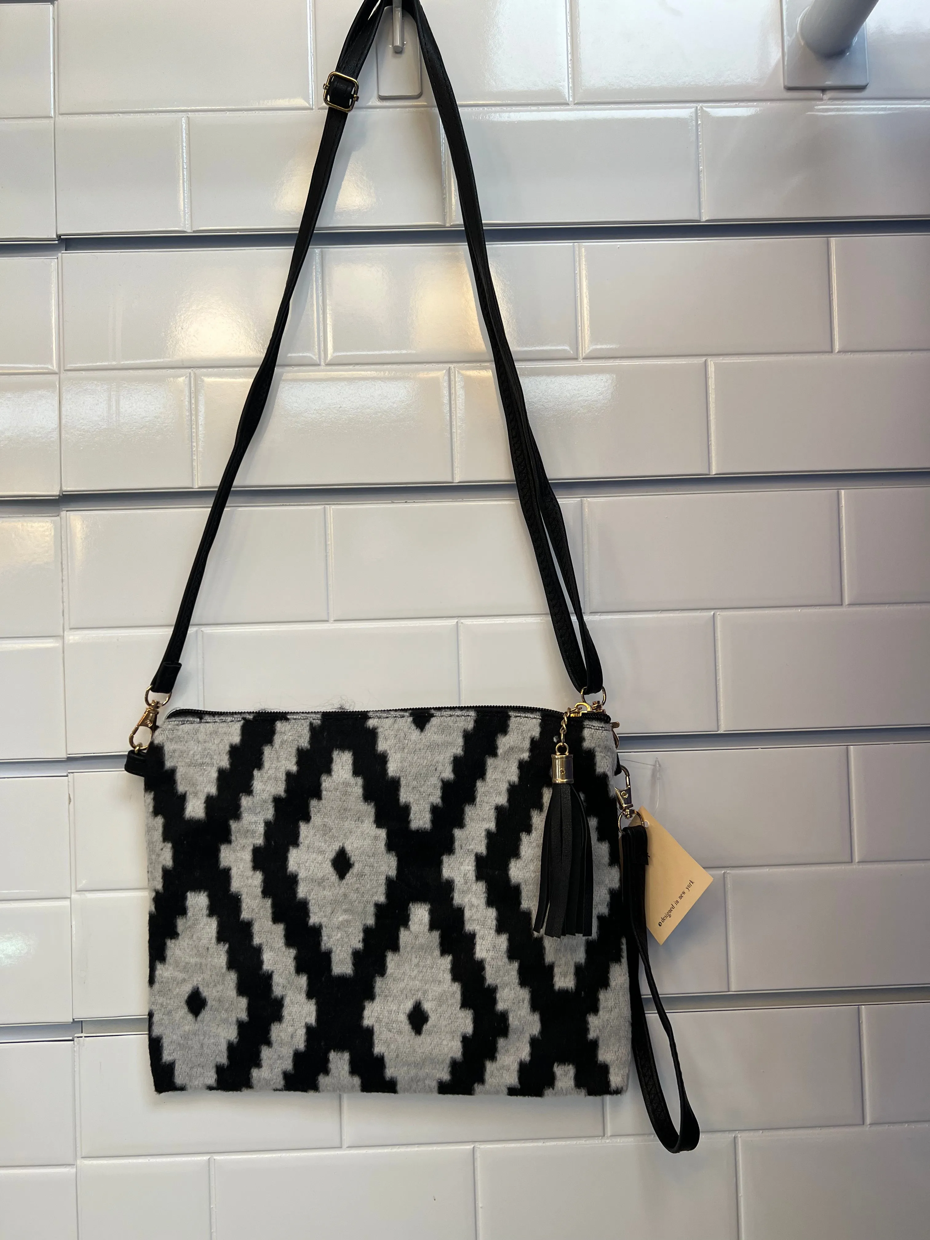 Crossbody handbags with wristlet straps