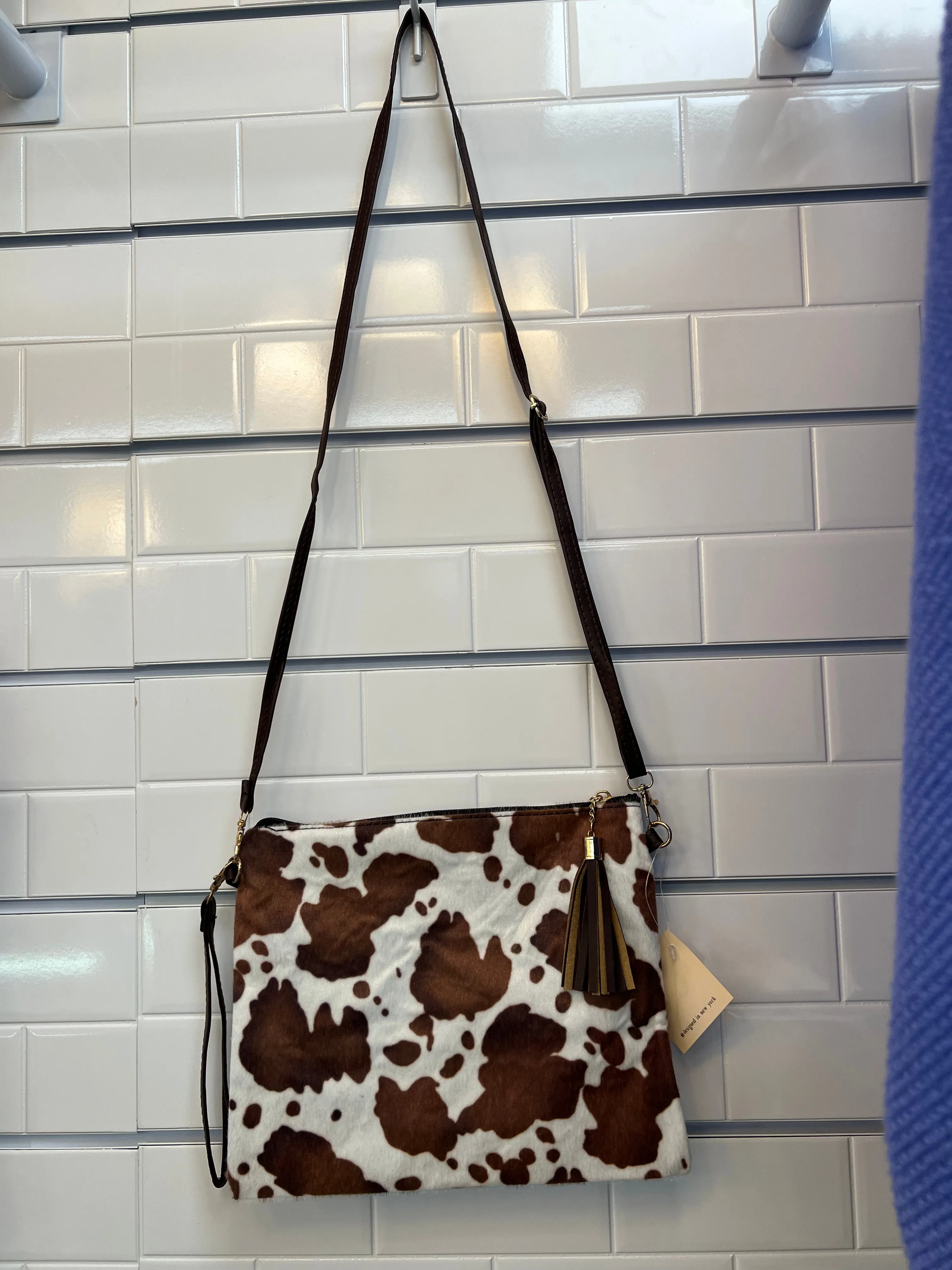 Crossbody handbags with wristlet straps